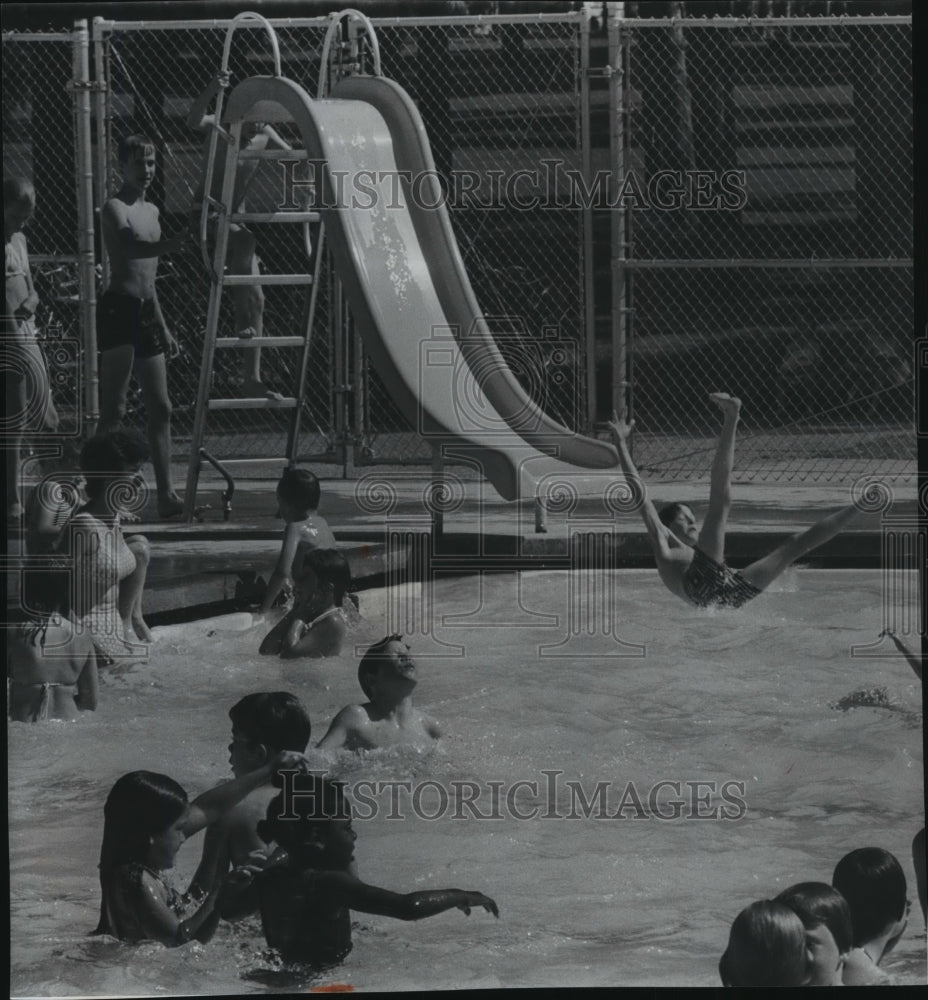 1975 Youngsters enjoy leisure time in the swimming pool-Historic Images