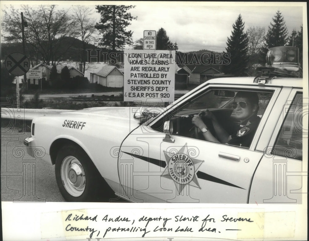 1981 Deputy Sheriff Richard Andres patrolling Loon Lake, Stevens Co.-Historic Images