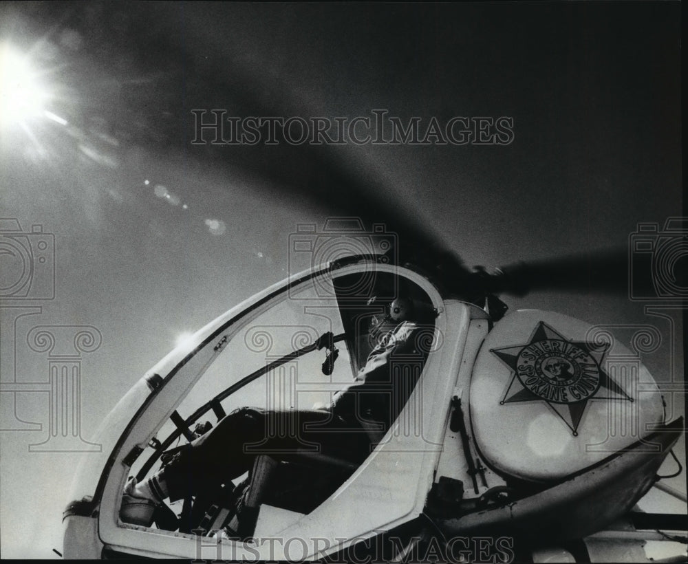 1989 Wayne Spokane Co. Sheriff's Dept spotting in helicopter Historic Images