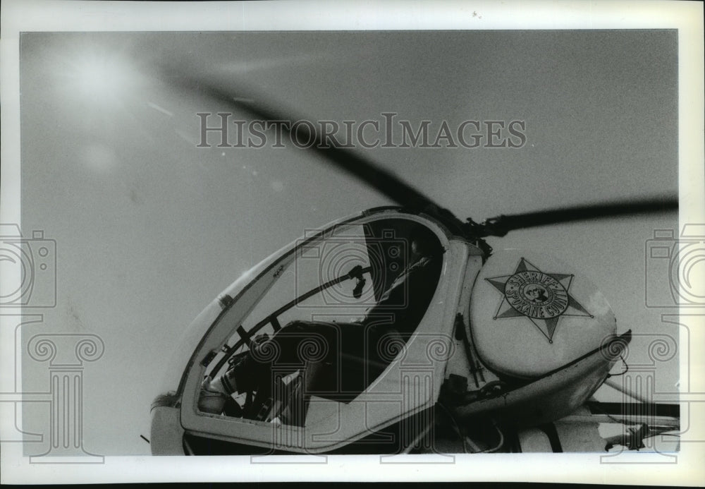 1989 Wayne deputy with Co. Sheriff's dept. rides helicopter Historic Images