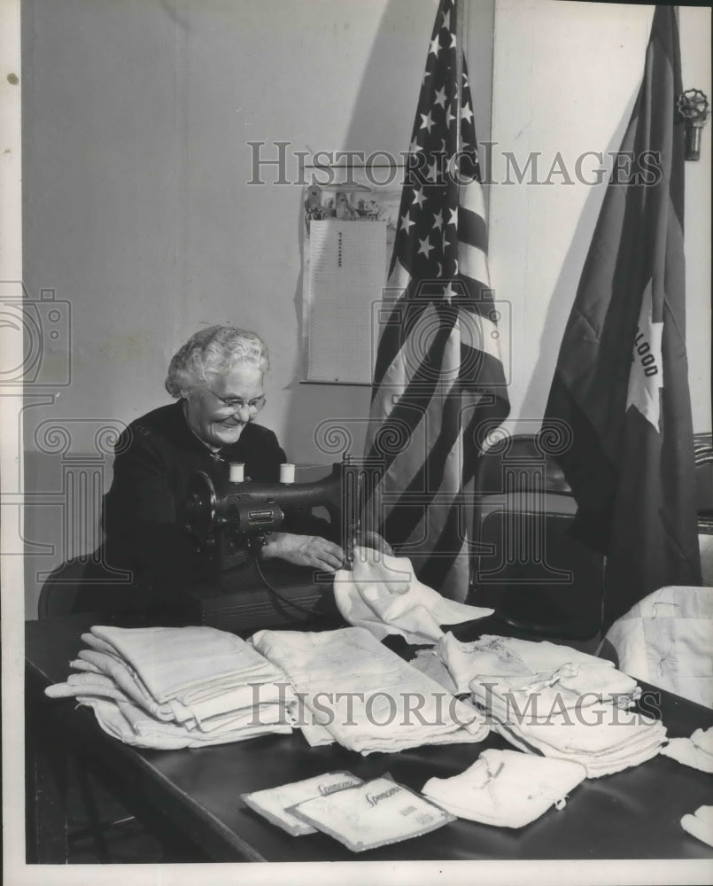 1952 Mrs. Eva Pike, Salvation Army volunteer, at sewing machine