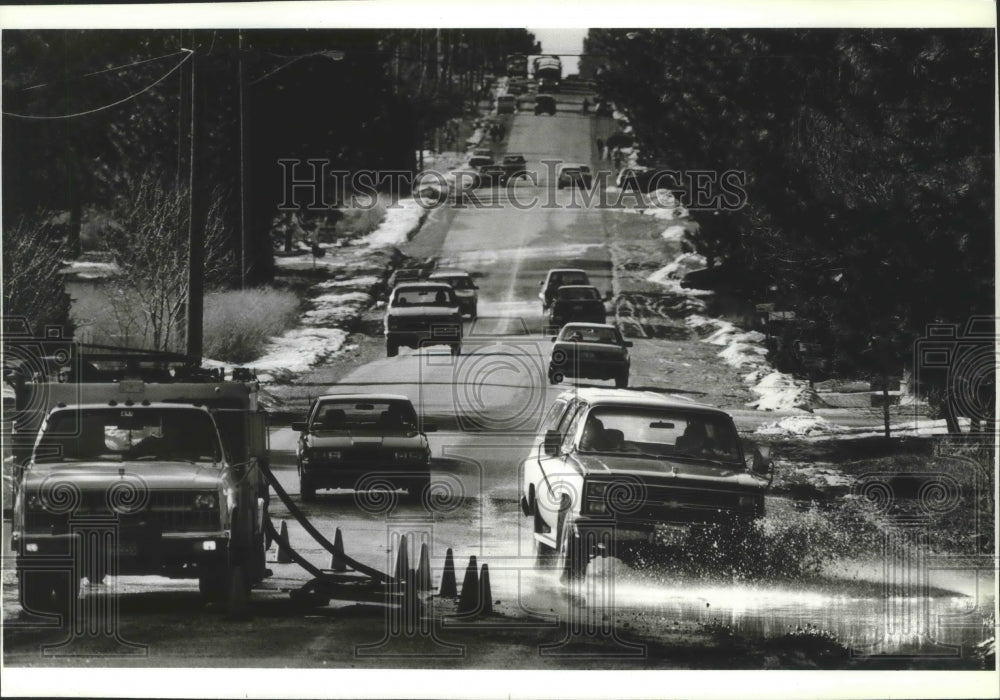 1989 Press Photo Large puddles of melted snow on 37th west of Havana - spb14601 - Historic Images