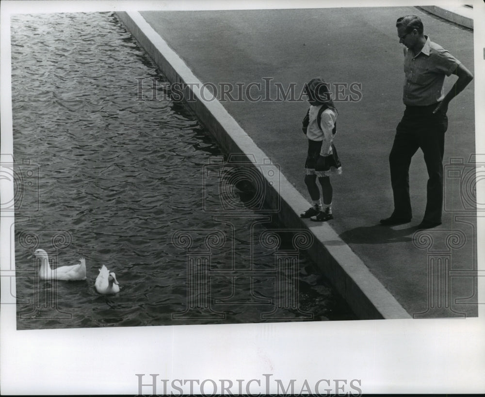 1975 Wayne Waynestinger and daughter Shirley with ducks in Spokane-Historic Images
