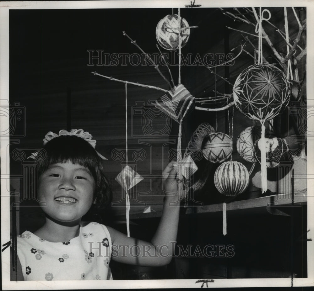1974 Kathy Ono shows off a Kusadama at Folklife festival at Expo '74