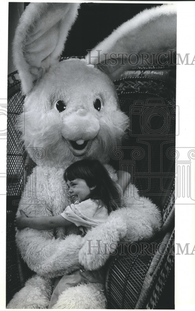 Press Photo Audra Fredrickson hugs the University City Easter Bunny - Historic Images