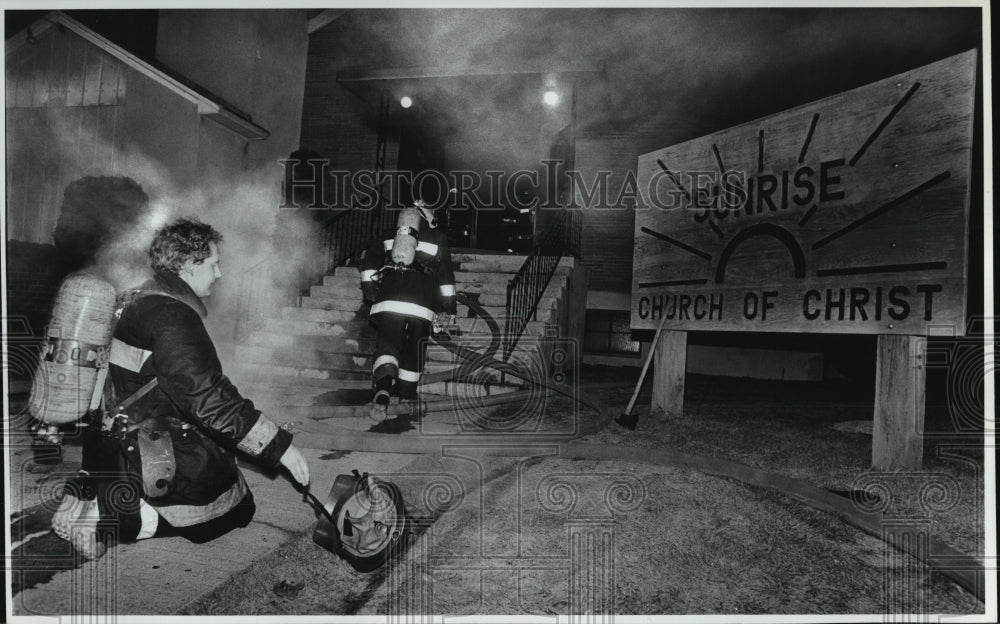 1988 Press Photo Firefighters fight a fire at the Sunrise Church of Christ - Historic Images