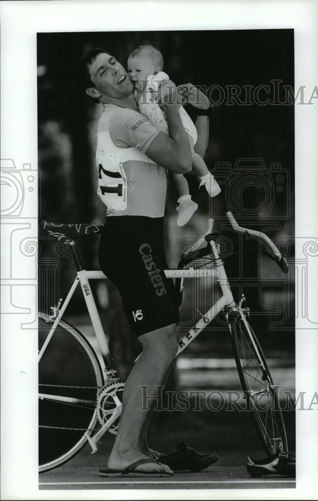 1988 Press Photo Cyclist Todd Buckley hugs his daughter after an Olympic trial - Historic Images