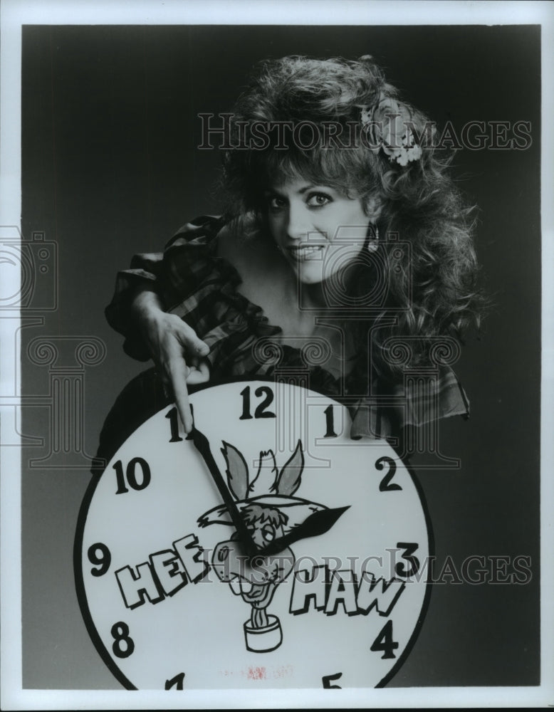 Press Photo Irlene Mandrell pointing a clock&#39;s hand - Historic Images