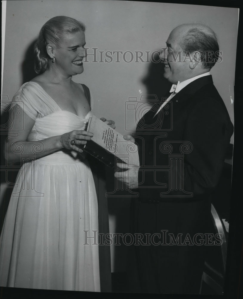 1954 Eugene Ormandy presents Verdi&#39;s Score to Frances Yeend - Historic Images