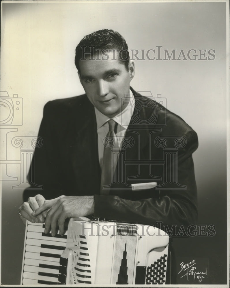 1960 Tony Lavelli plays the accordion, piano, sings and dances - Historic Images