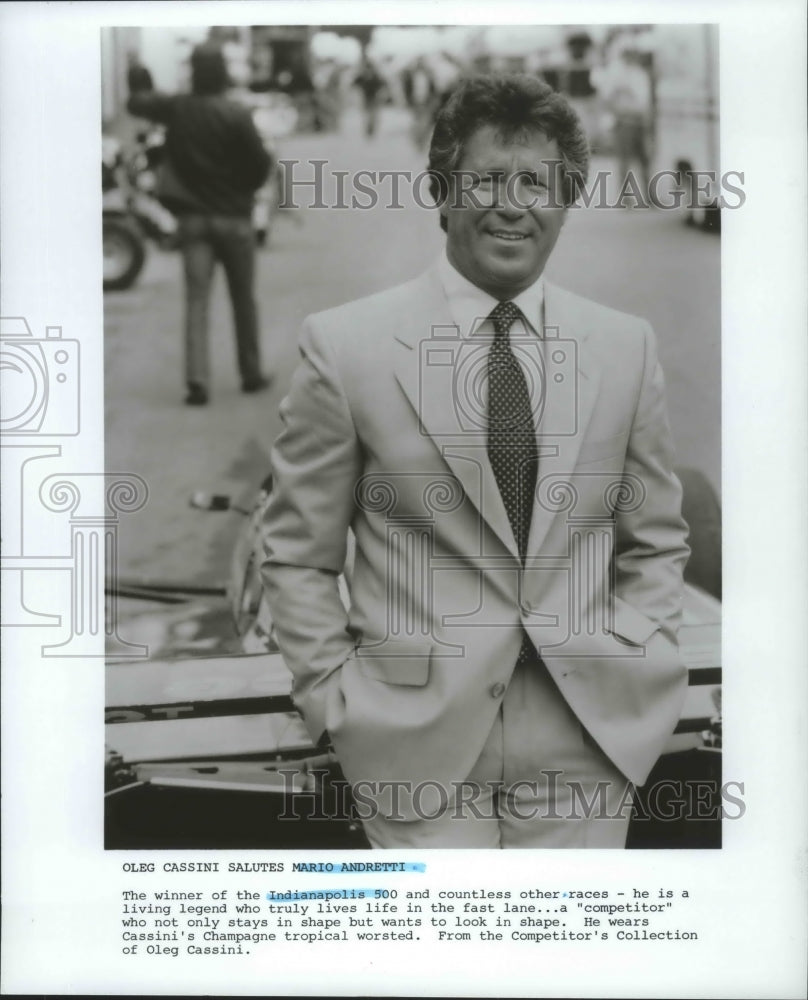 1986 Press Photo Auto racing superstar Mario Andretti wears Oleg Cassini fashion - Historic Images