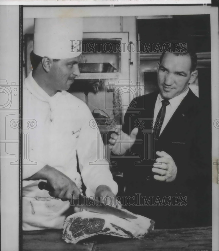 1962 Chef Emile Mooser cuts big steak for boxing champ, Gene Fullmer - Historic Images