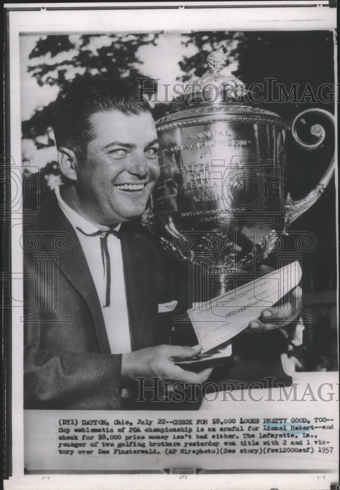 1957 Press Photo Golf champ, Lionel Hebert with his trophy and winning check-Historic Images