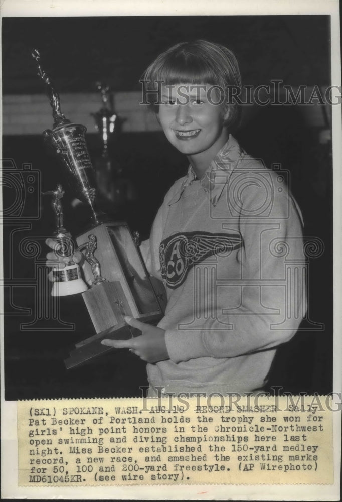 1951 Press Photo Swimming record holder, Pat Becker, displays her trophies - Historic Images