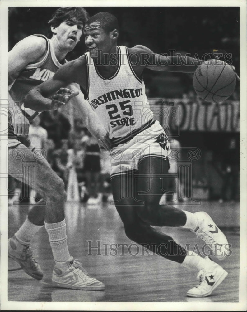 1984 Press Photo Keith Morrison pushing through his opponent with the basketball-Historic Images