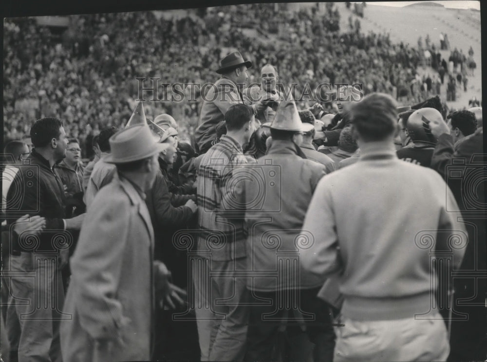 1956 Press Photo Vandals football coach, Skip Stahley, lifted up by players - Historic Images