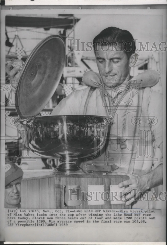 1959 Press Photo Mira Slovak looks into the cup after winning the Lake Mead cup- Historic Images