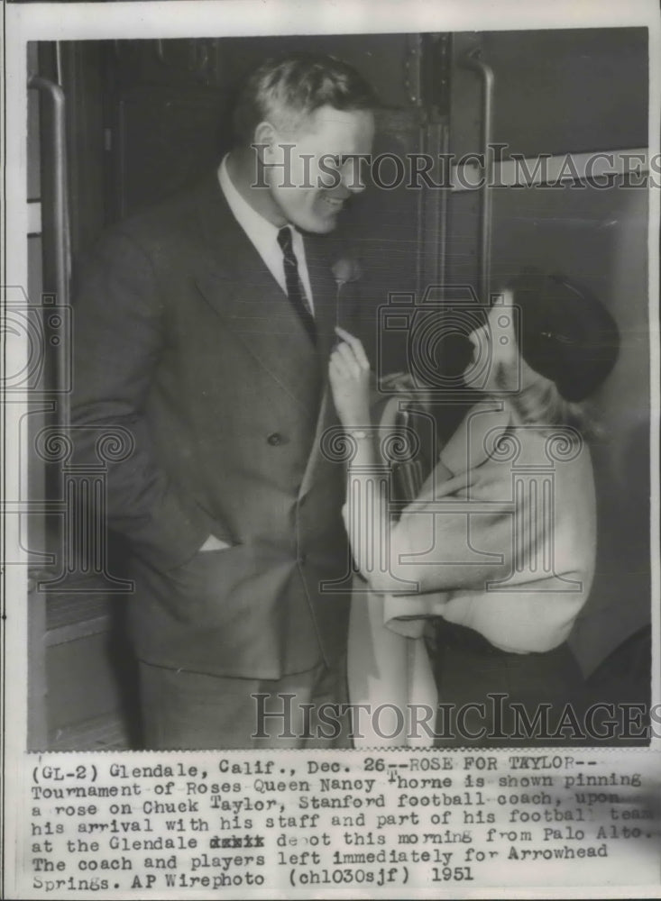 1951 Press Photo Rose Bowl Queen greets Chuck Taylor, Stanford football coach - Historic Images