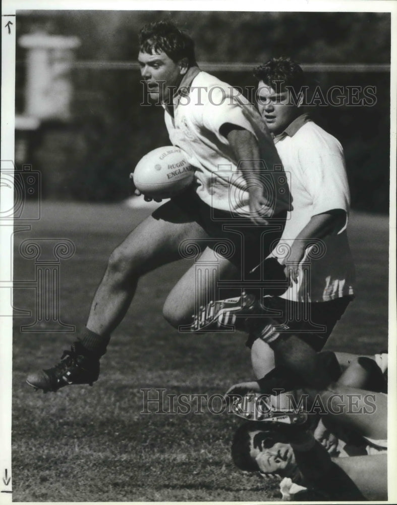 1993 Press Photo Dale Swift, rugby player rolls over an opponent - sps12945-Historic Images