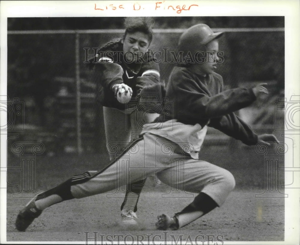 1991 Sophia Jimenez tags out Tonya Wisdom in softball action - Historic Images