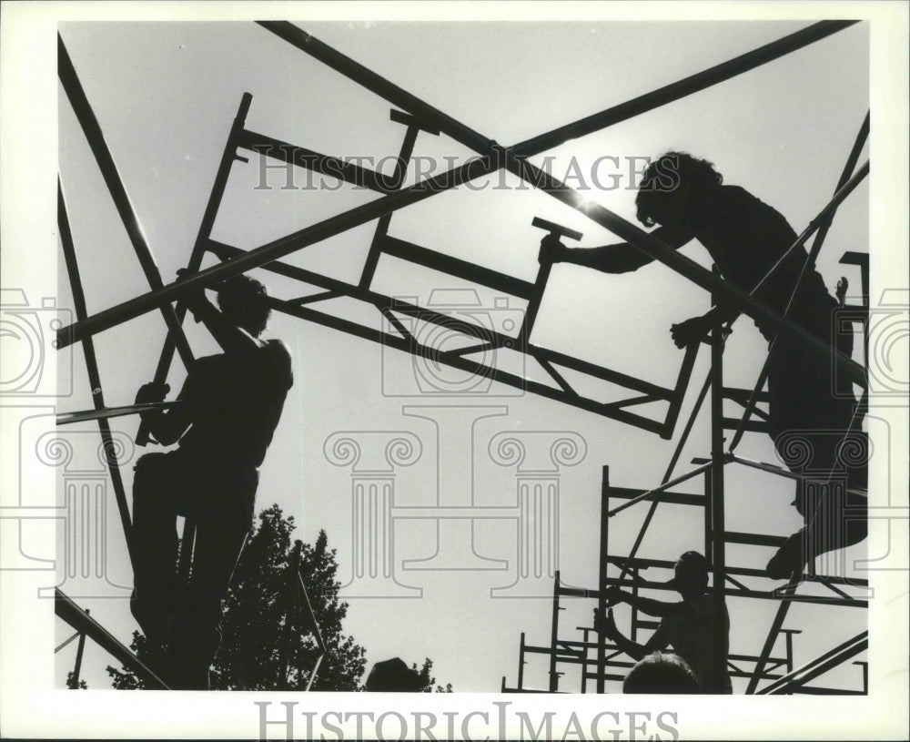 1987 Press Photo Workers build grandstands for the Spokane Grand Prix race- Historic Images