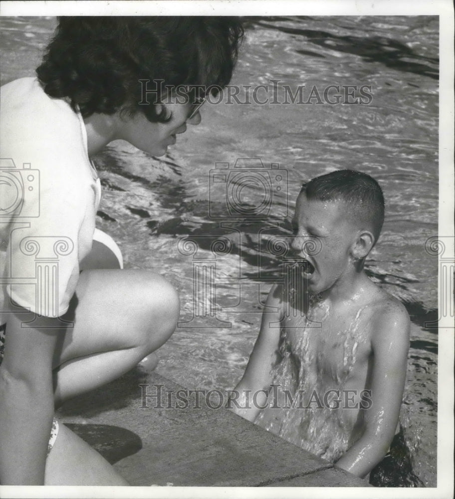 1966 Swim pupil Doug Lindvall surfaces near Lori Gausman - Historic Images