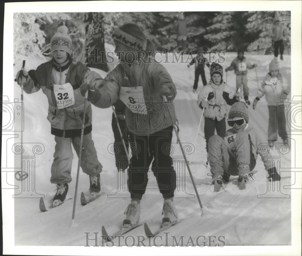 1994 Press Photo Junior Langlauf skier, #63Travis Curley, finishes race-Historic Images