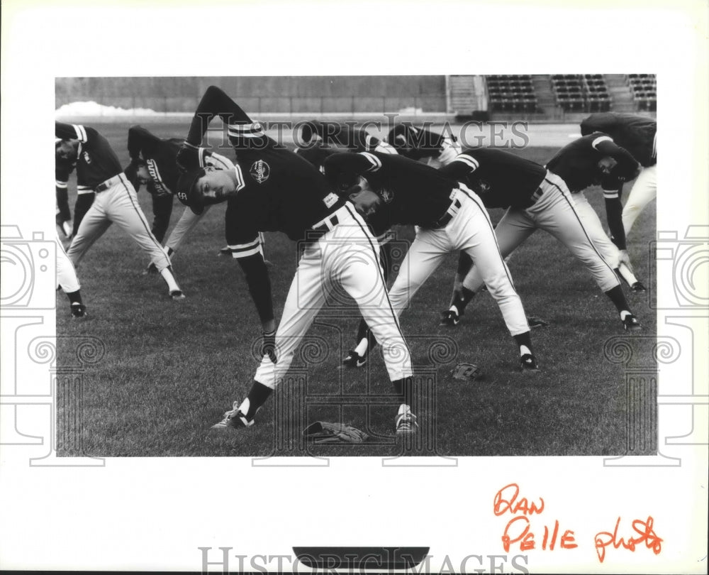 1990 Press Photo Spokane Indians baseball players stretching to prepare for game- Historic Images