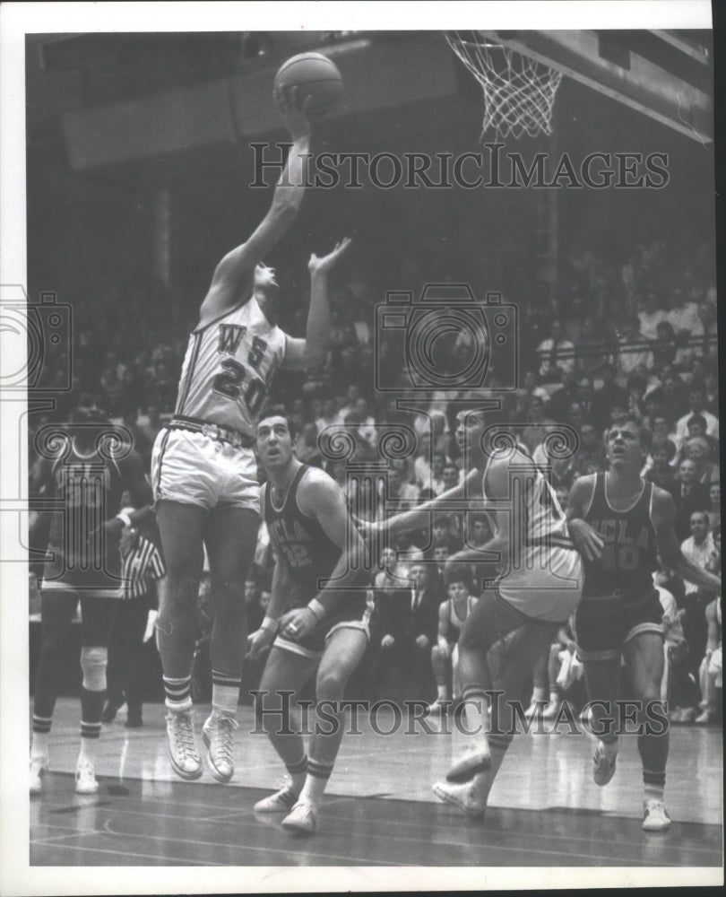 1970 WSU Basketball Player Jumps Up to Make a Shot Against UCLA - Historic Images