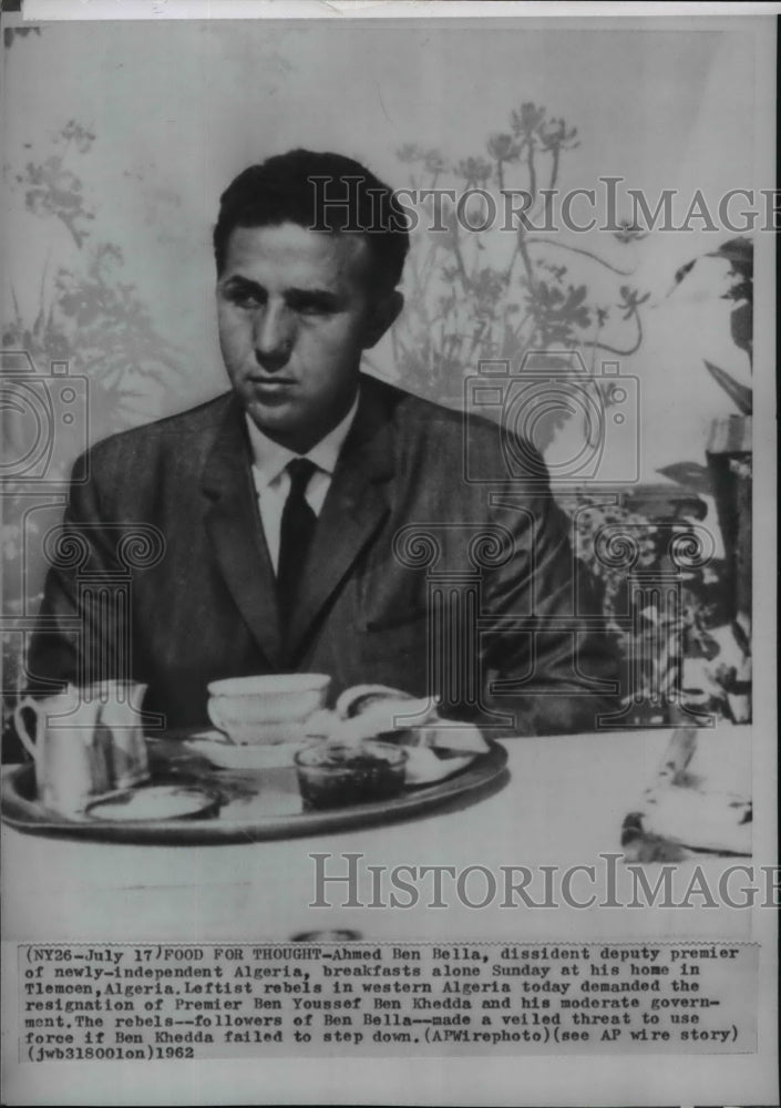 1962 Press Photo Ahmed Ben Bella of Algeria reflects in front of his breakfast - Historic Images