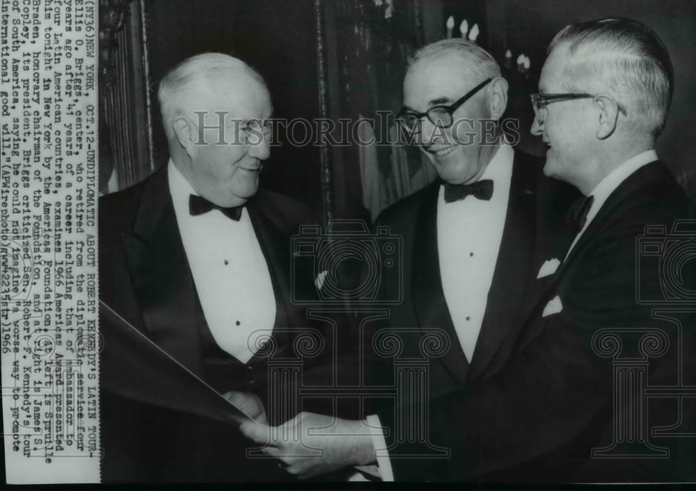 1966 Wire Photo Ellis O. Briggs examining his 1966 Americas Award - spw00885 - Historic Images