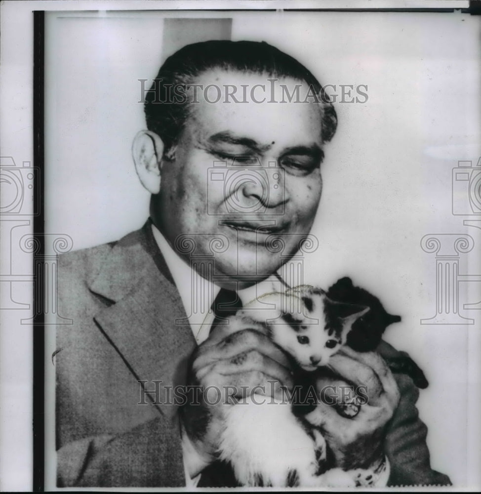 1958 Wire Photo Fulgencio Batista holding two kittens at his home near Havana - Historic Images