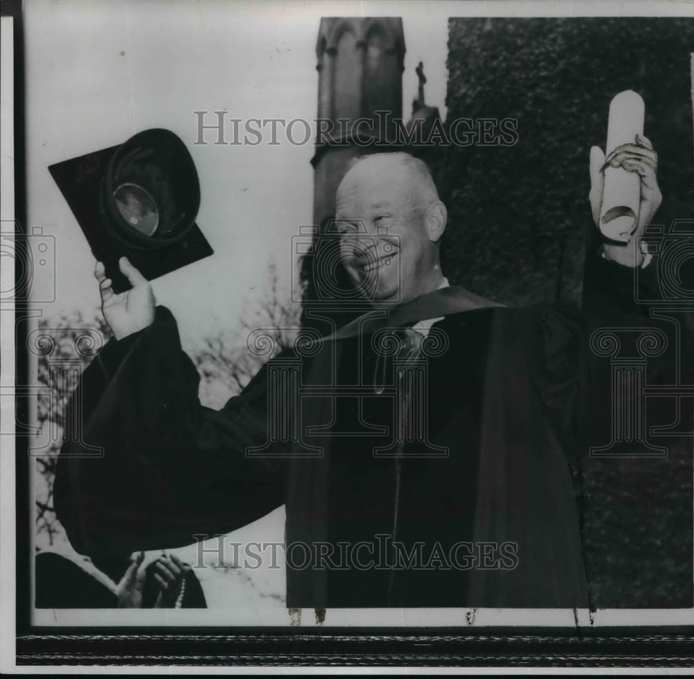 1954 Wire Photo President Eisenhower with mortarboard and diploma in hand - Historic Images