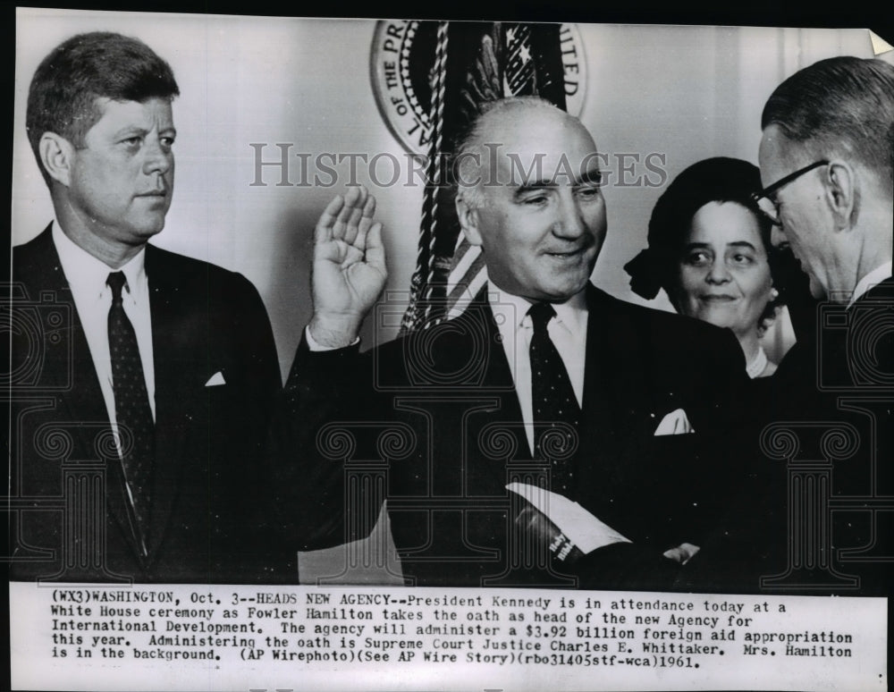 1961 Press Photo Fowler Hamilton takes oath with Pres. Kennedy at White House. - Historic Images