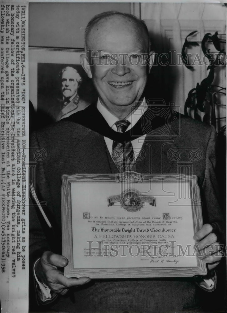 1958 Wire Photo Pres. Eisenhower posing with a certificate at the White House - Historic Images