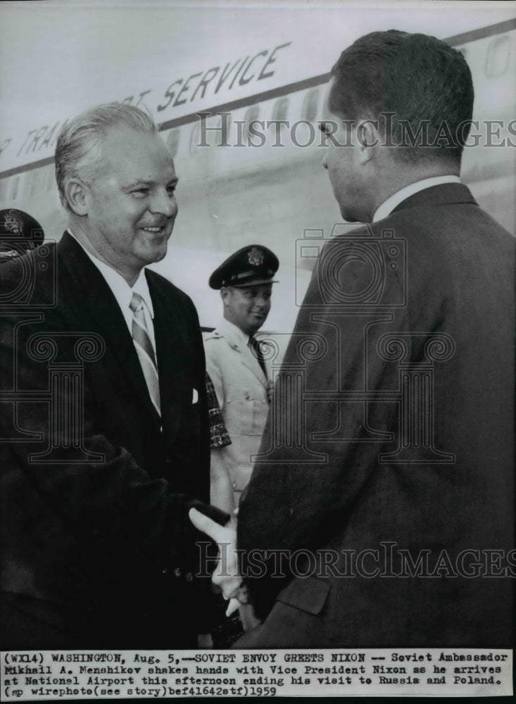 1959 Press Photo Soviet Ambassador Mikhail Menshikov shakes hands with Nixon. - Historic Images