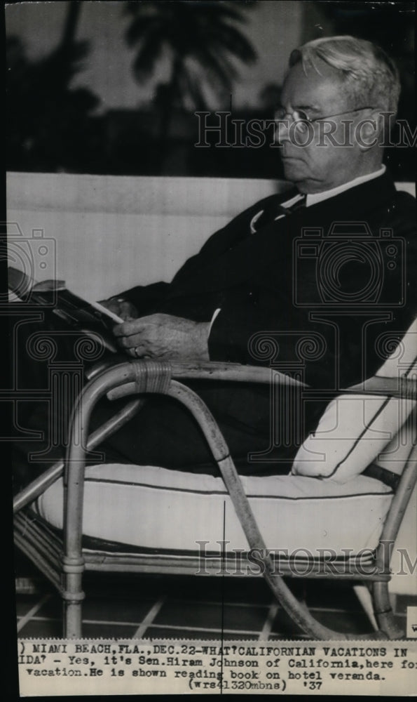 1937 Press Photo Sen. Hiram Johnson on vacation reading a book at hotel Veranda. - Historic Images