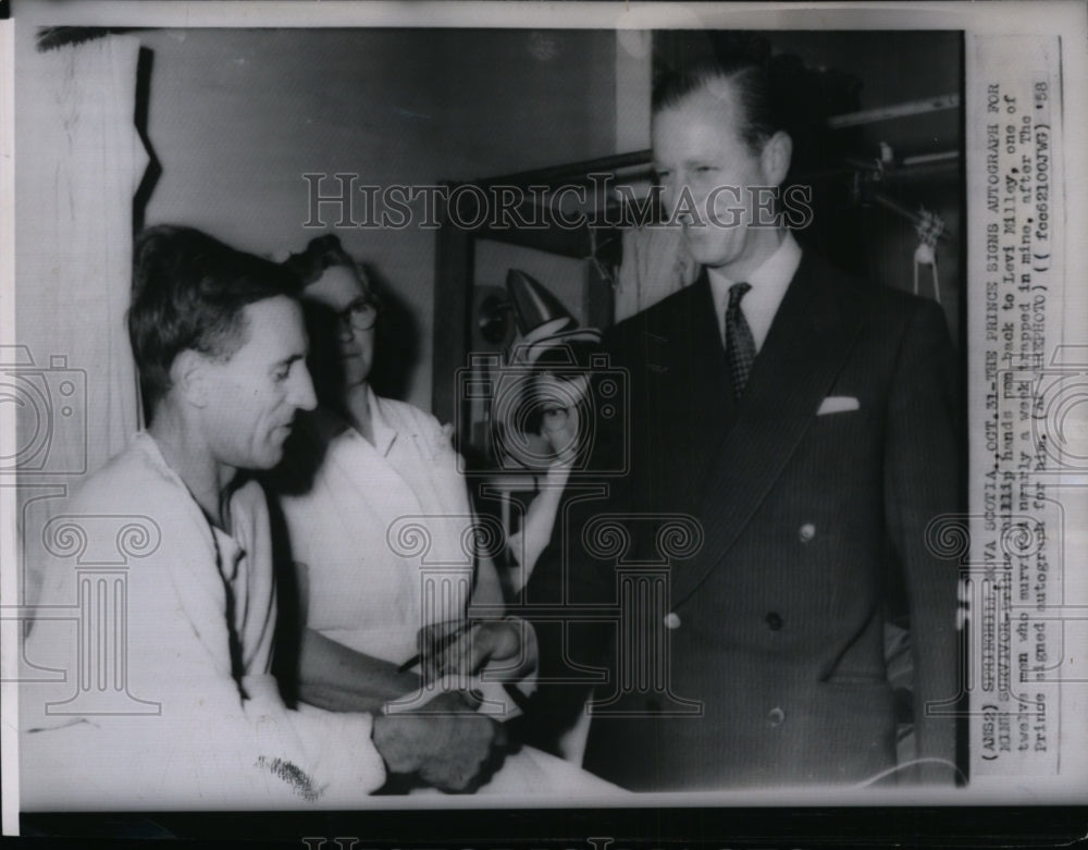 1958 Press Photo Prince Phillip signing autograph for mine survivors - Historic Images