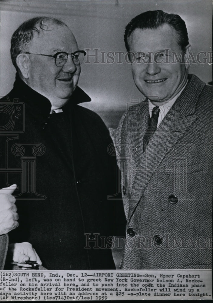 1959 Press Photo Sen. Homer Capeheart greeted Gov. Rockefeller at the airport - Historic Images