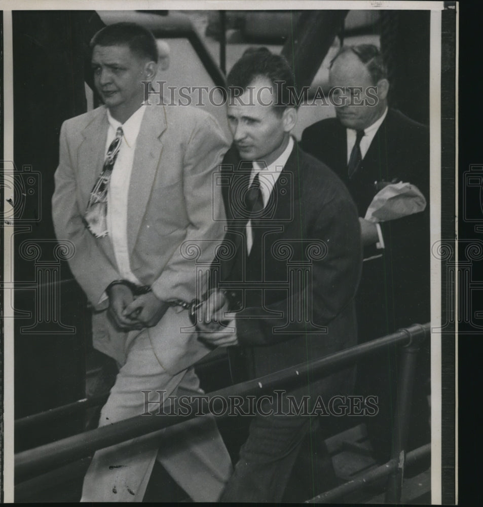 1953 Robert Thompson heads into court handcuffed to another man - Historic Images