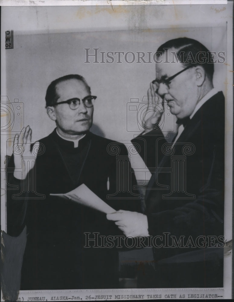 1961 Press Photo Rev. Segundo Llorento sworn in by Alaska Security of state. - Historic Images