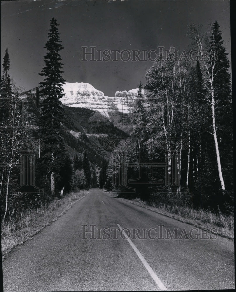 1955 Garden Wall towers in heart of Glacier National Park, Montana - Historic Images