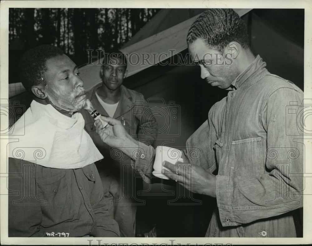 1942 Pte Walter Donald and Pte Joseph Lawrence at road camp barber-Historic Images