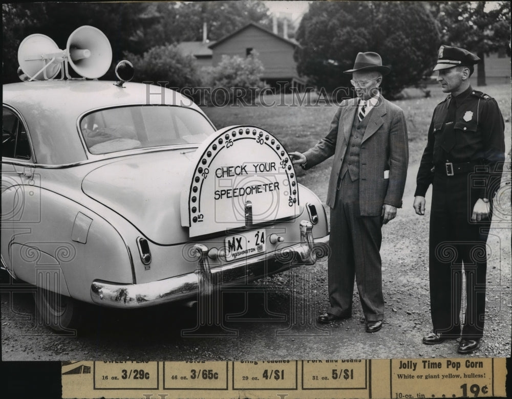 Professor Homer J Dana and Capt R.W. Zottman look at speedometer-Historic Images