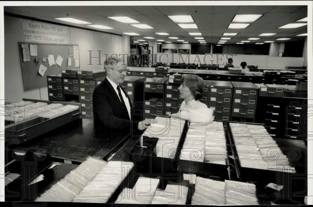 Press Photo Donald Cochran and Marjorie Brown in State Probation file room.- Historic Images