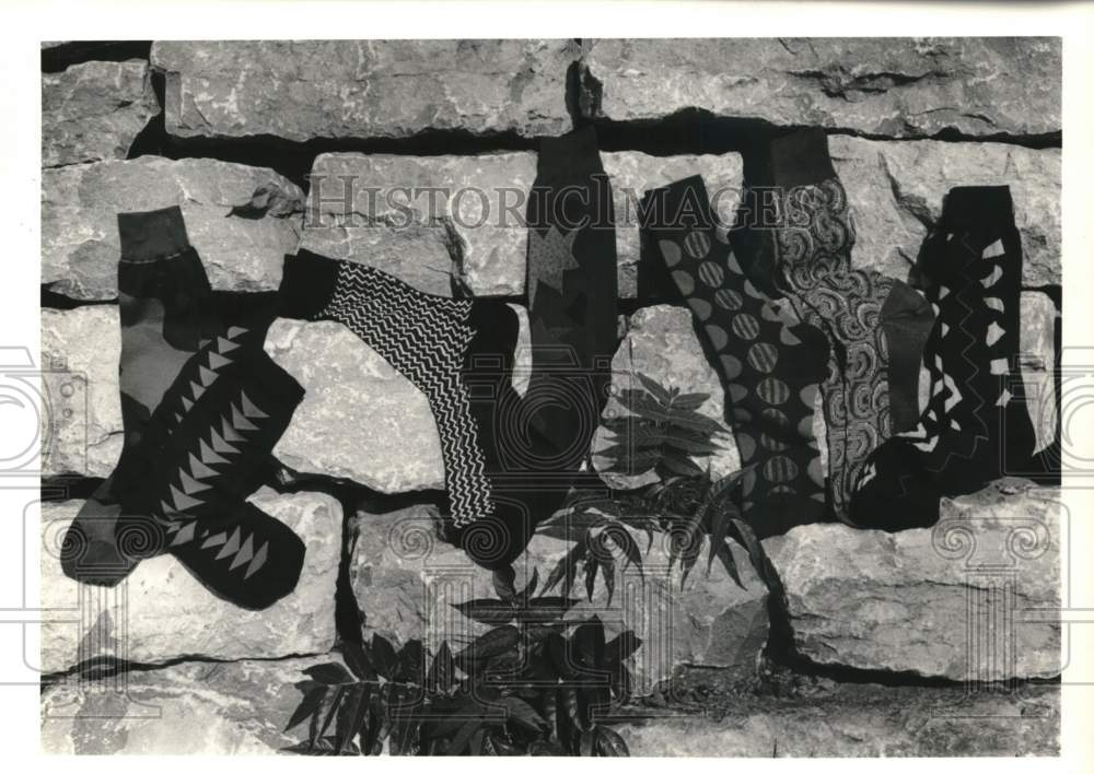 1990 Press Photo Pattern Socks on Rock Display - Historic Images