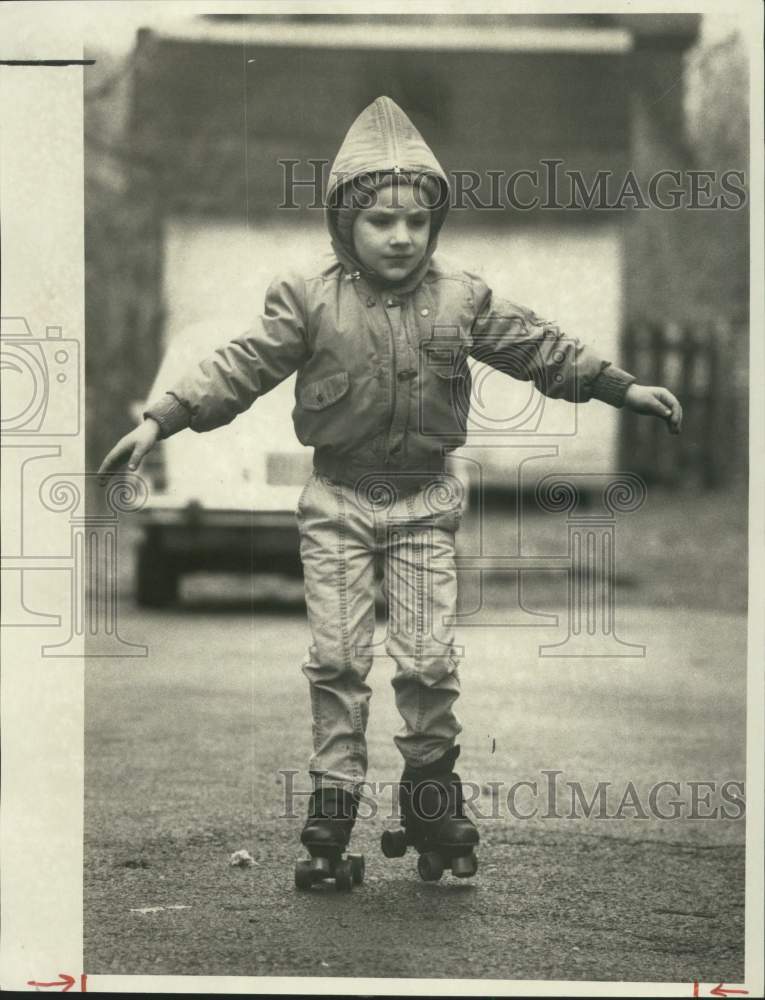 1986 Press Photo Child Roller Skating in Road - sya10353 - Historic Images