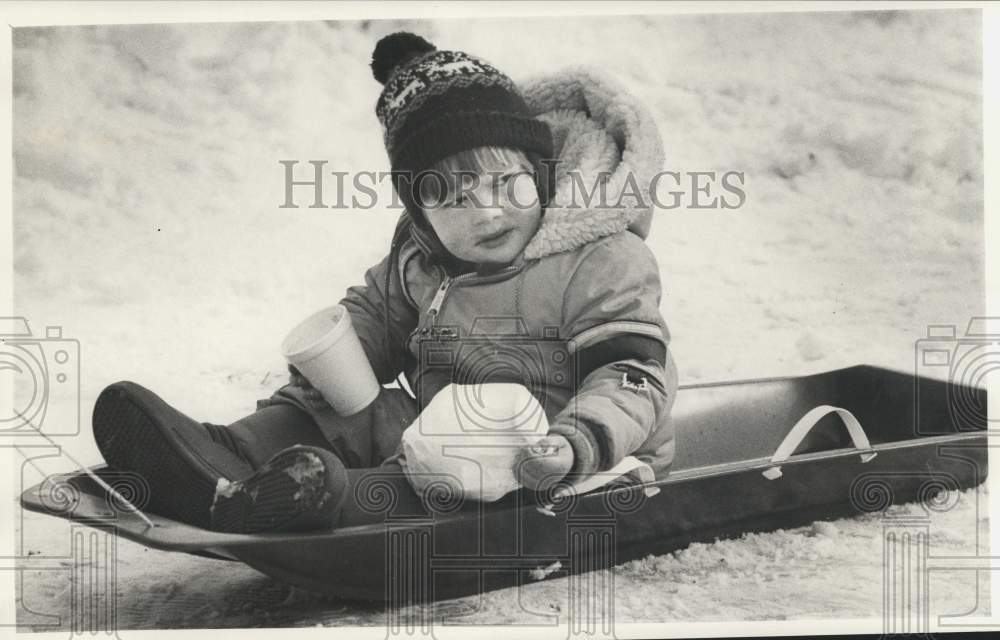 Press Photo Jonathan Mason Sledding at Thorndon Park Winter Festival - sya21217- Historic Images