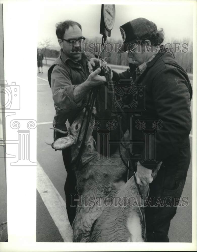 1989 Hunters Weighing Deer on Scale-Historic Images