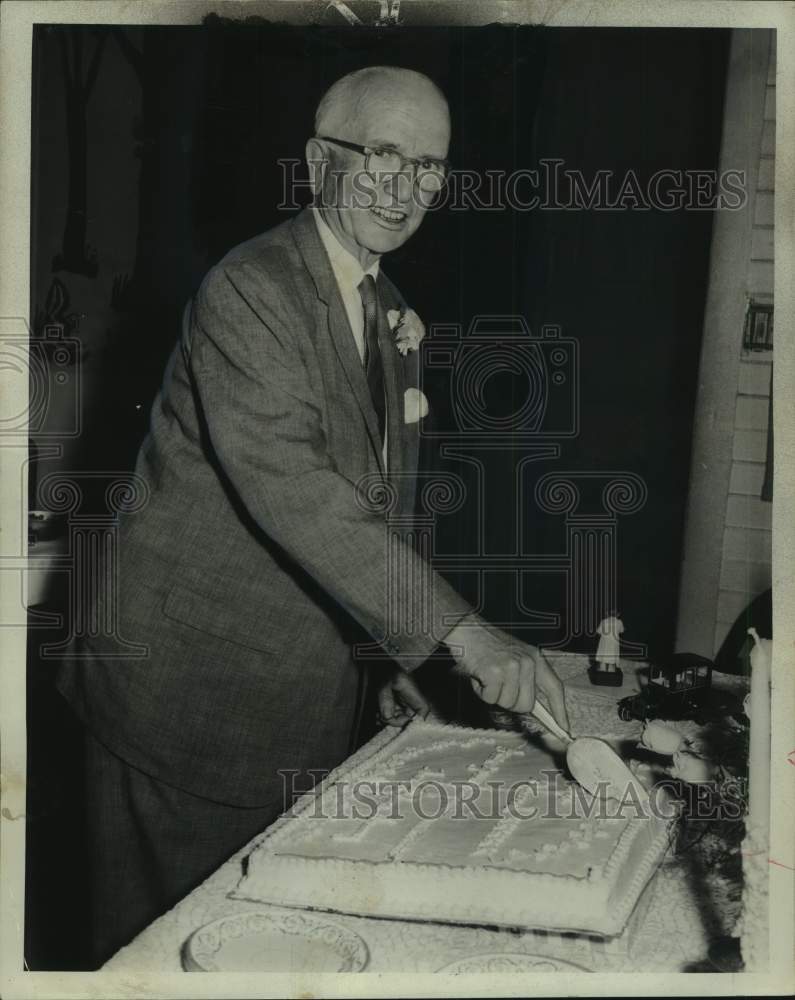 1962 Dr. Eugene Boudrean slices 50th Anniversary Cake for Medicine-Historic Images